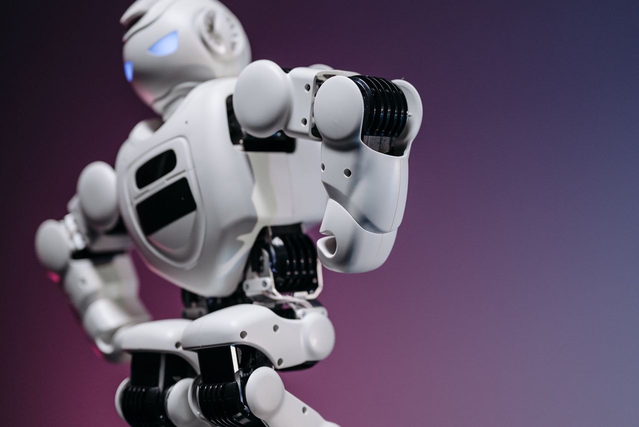 home-hero-bg Close-up of a futuristic white robot showcasing innovation and design.